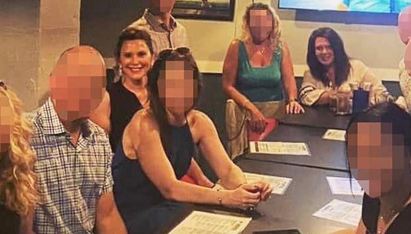 Gov. Whitmer at restaurant with large group